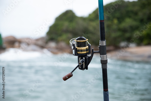 fishing rod and reel on the beach