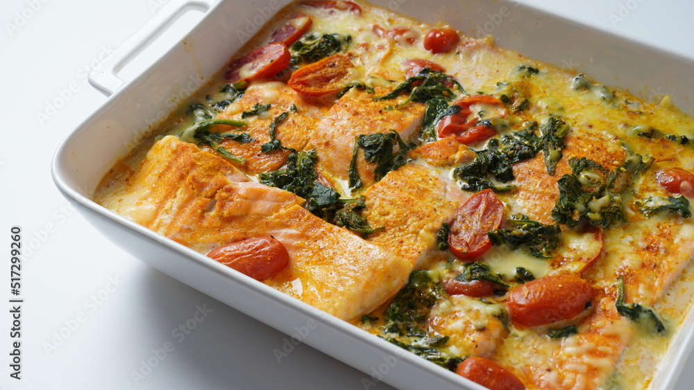 Salmon Fillet  with spinach and cherry tomatoes in creamy sauce