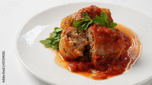 Stuffed cabbage rolls with tomato sauce and herbs