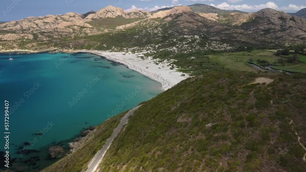 Aerial view of holidaymakers enjoying the turquoise Mediterranean sea at Ostriconi beach in the Balagne region of Corsica Aerial view of holidaymakers enjoying the turquoise Mediterranean sea at Ostriconi beach in the Balagne region of Corsica