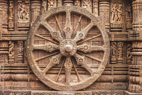 Chariot wheel from Konark Sun Temple, which is a 13th-century CE Sun temple at Konark about 35 kilometres northeast from Puri city on the coastline in Puri district, Odisha, India. photo