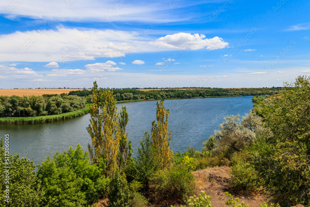 Summer landscape with beautiful river, green trees and blue sky