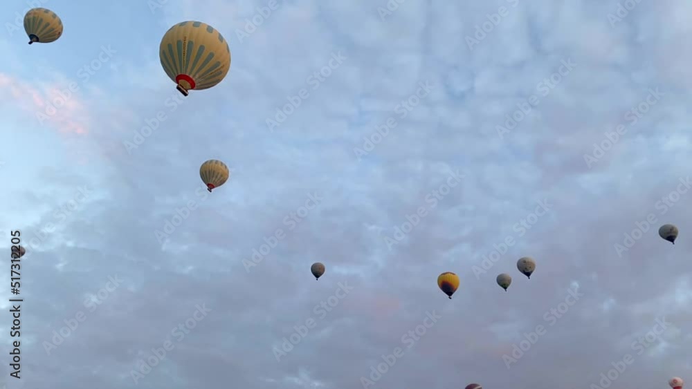 Hot air balloons in the sky during sunrise. Travel, dreams come true concept Hot air balloons in the sky during sunrise. Travel, dreams come true concept