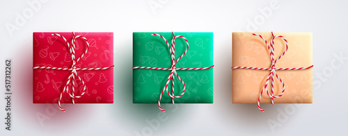 Christmas gifts vector set design. Christmas gift boxes wrapped with minimalist pattern and twine ribbon in top view for 3d present decoration collection. Vector illustration.
