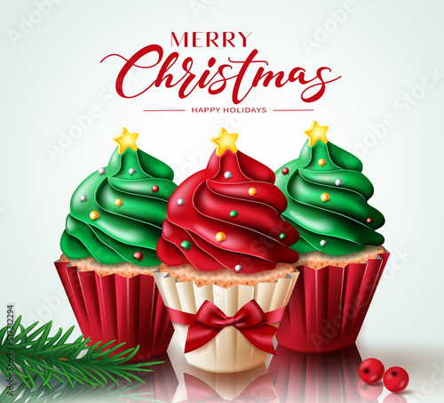 Christmas cupcake vector concept design. Merry christmas greeting text with cup cake elements for xmas holiday season dessert decoration. Vector illustration.
