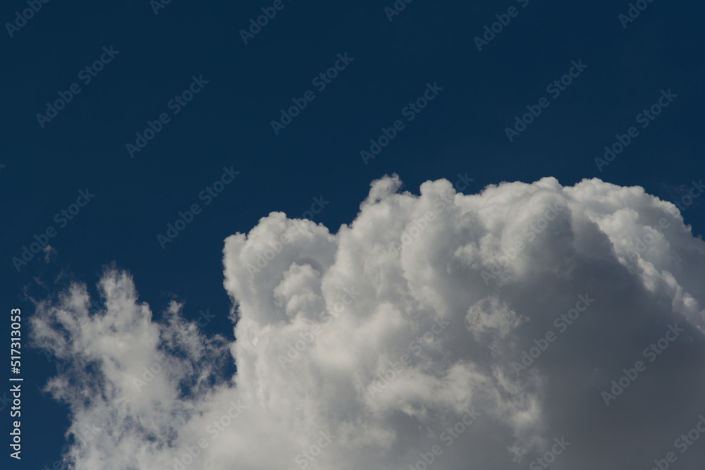 Moody clouds. Blue sky background. Low key photo. Copy space Moody clouds. Blue sky background. Low key photo. Copy space