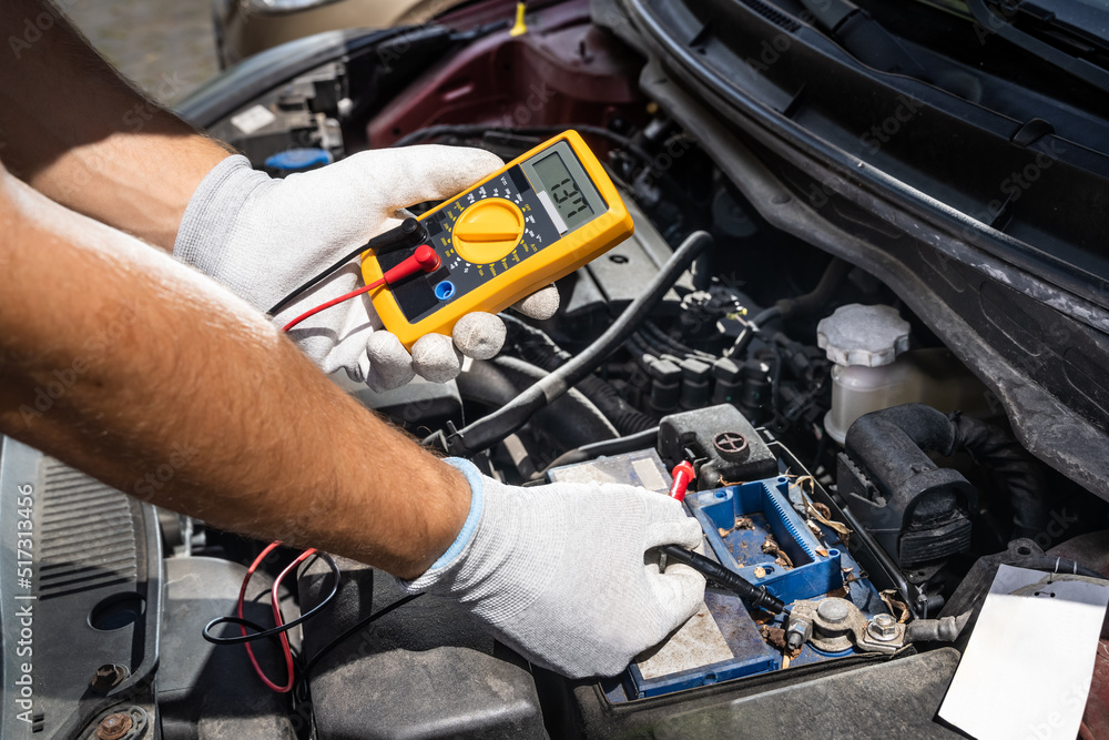 Car Electronic Maintenance Service And Check. Worker Man Car Electronic Maintenance Service And Check. Worker Man