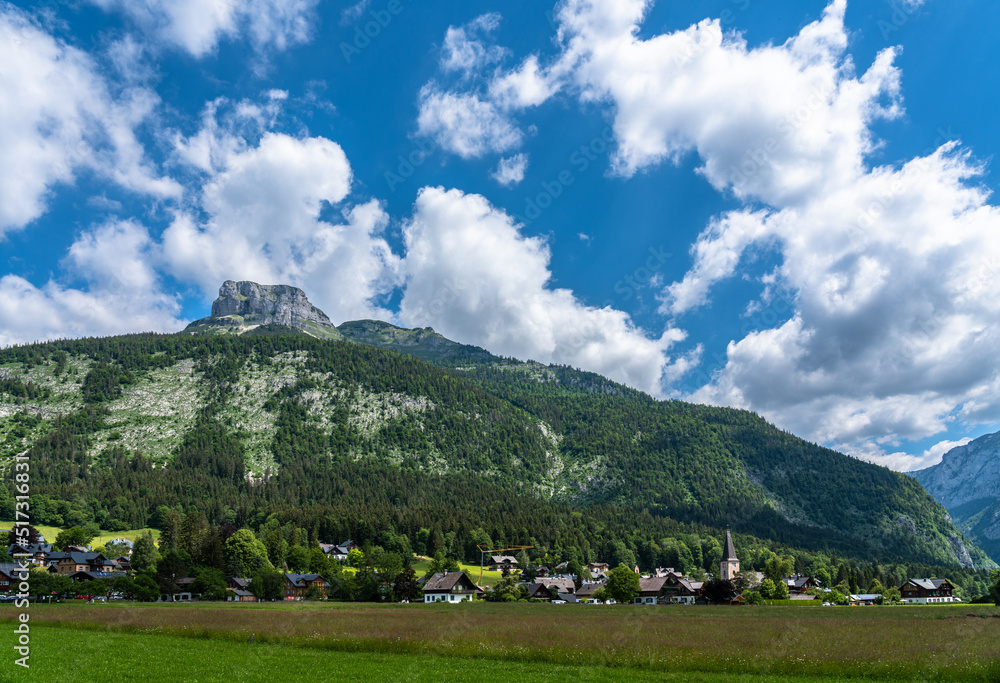 Beautiful idyllic panorama view of Altaussee town with the peak Loser in background on a sunny summer day with blue sky cloud, Styria, Austria