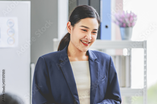 Closeup shot of Asian pretty happy cheerful female businesswoman intern trainee in casual suit standing smiling in company office Free Download Closeup shot of Asian pretty happy cheerful female businesswoman intern trainee in casual suit standing smiling in company office - GFXLoad