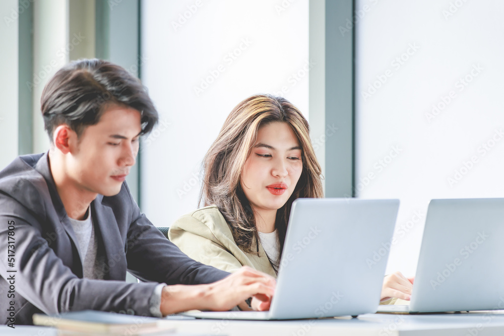 Closeup shot of Asian pretty happy cheerful female businesswoman intern trainee in casual suit sitting smiling f in company office Closeup shot of Asian pretty happy cheerful female businesswoman intern trainee in casual suit sitting smiling f in company office