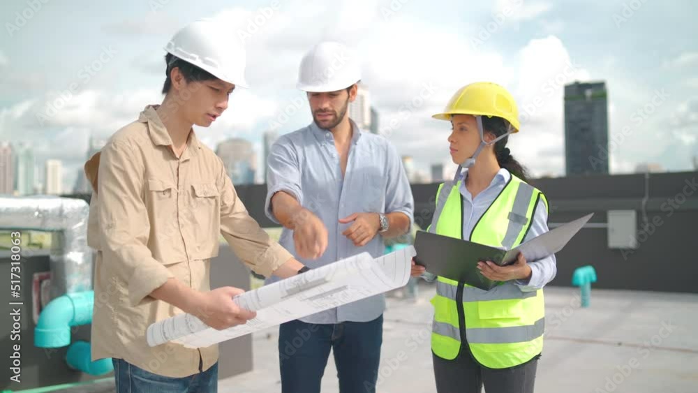 Three engineer or technician workers discuss with building plan or blueprint then shake hands for success of the project in area of construction site. Three engineer or technician workers discuss with building plan or blueprint then shake hands for success of the project in area of construction site.