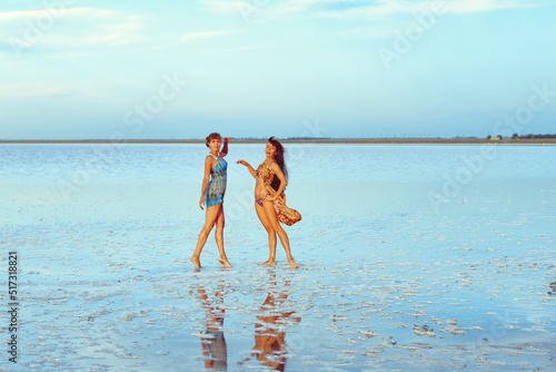 a girl in a swimsuit on a salt lake