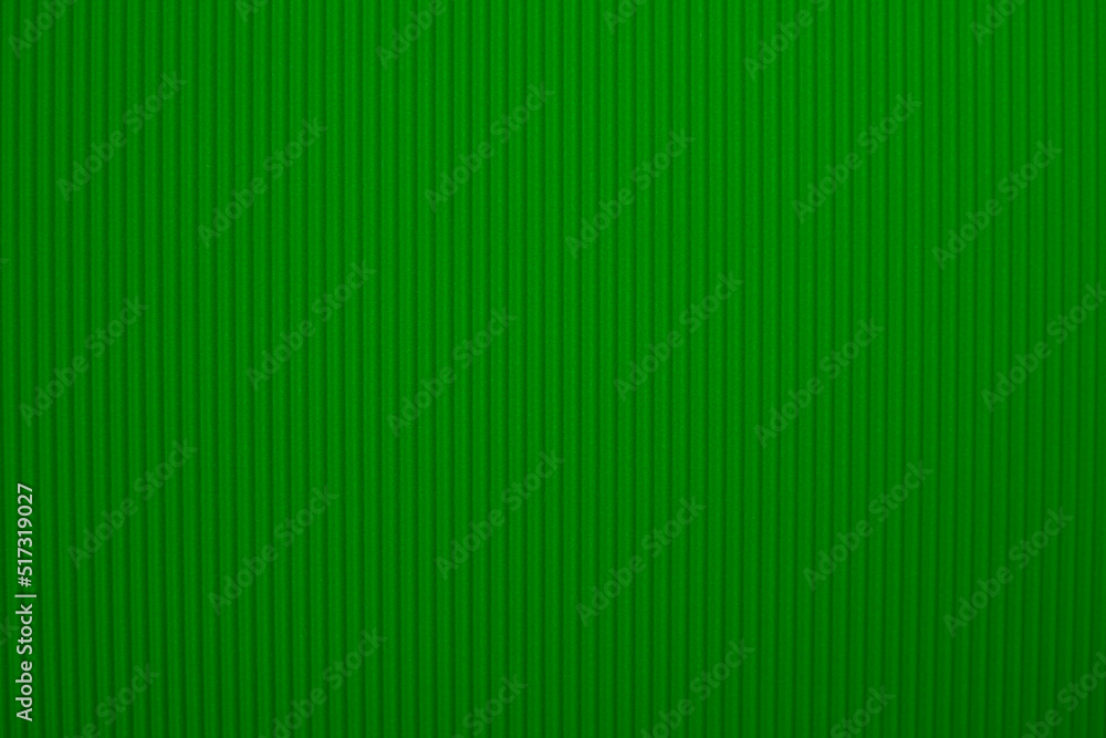 Abstract background made of corrugated paper for green application. Space for text. Texture. Vertical stripes. Abstract background made of corrugated paper for green application. Space for text. Texture. Vertical stripes.