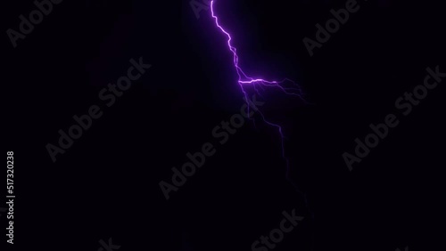 Realistic purple lightning on black background. photo