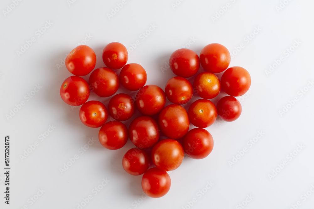 Cherry tomatoes arranged in the form of heart Cherry tomatoes arranged in the form of heart