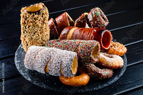 Canvas Print Trdelnik or trdlo is traditional czech sweet hollow roll pastry dough covered wi
