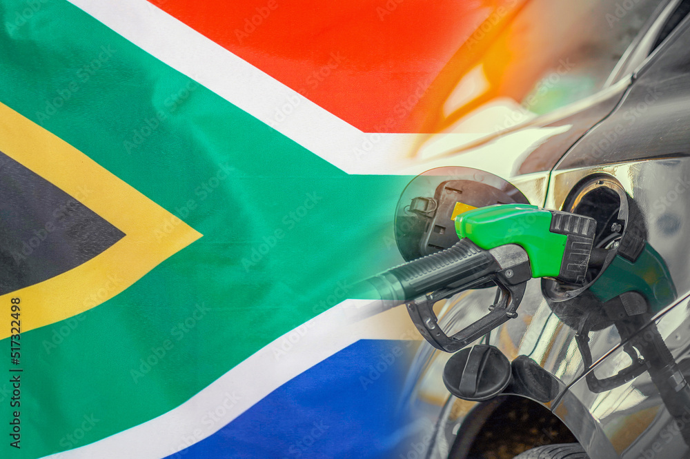 Car with a fuel injector on South Africa flag background. Record prices