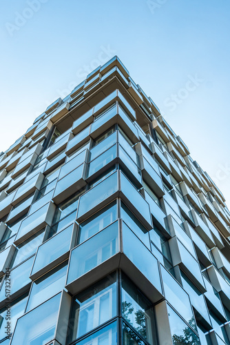 Skyscraper glass facades on the blue sky background