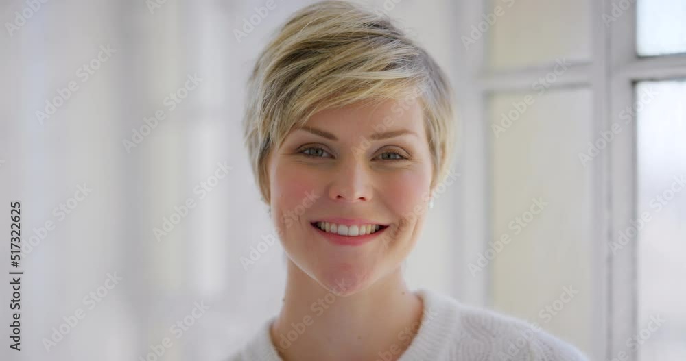 A beautiful stylish woman standing with a bright smile in her home or house. Portrait of a happy young confident business female in her office. The face of a joyful and delighted entrepreneur A beautiful stylish woman standing with a bright smile in her home or house. Portrait of a happy young confident business female in her office. The face of a joyful and delighted entrepreneur