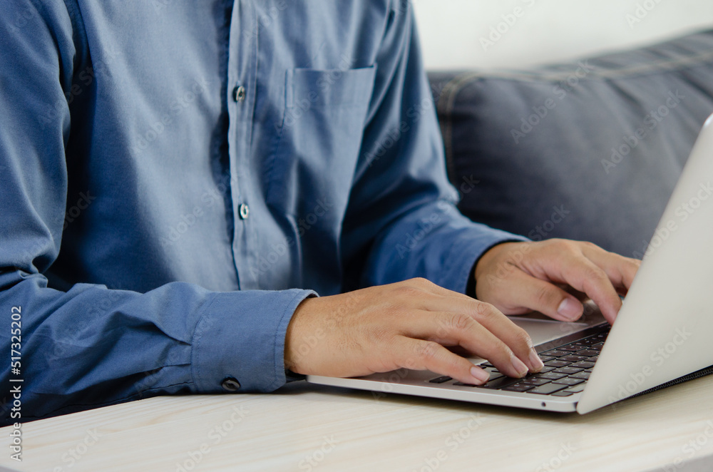 Businessman hand typing keyboard on laptop computer. Close up businessman communicating internet and social media at his desk. Businessman hand typing keyboard on laptop computer. Close up businessman communicating internet and social media at his desk.