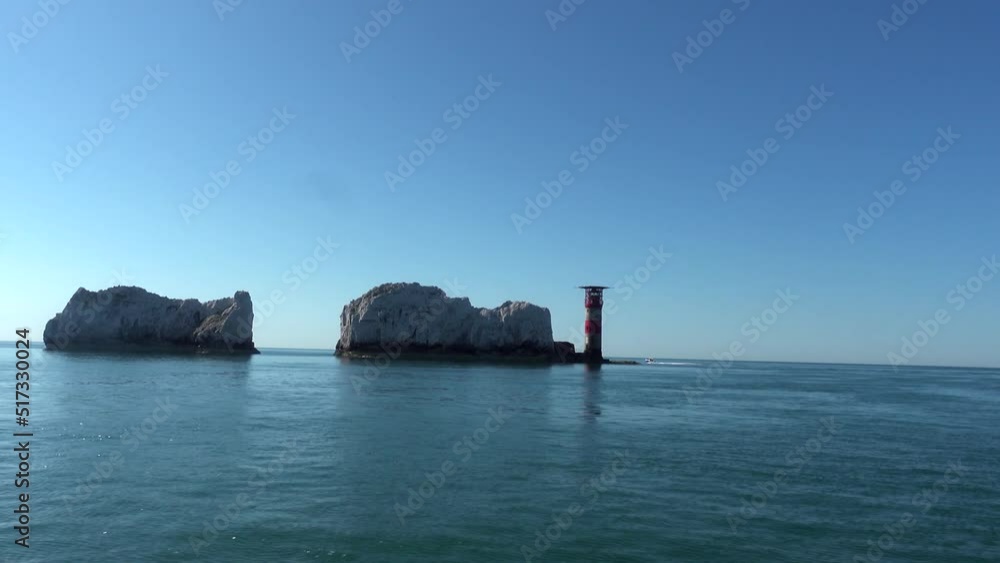 The Needles lighthouse filmed from a yacht on a very calm sunny day plus 2 of the chalk stacks on the Isle of Wight close to Alum Bay and Totland Bay. The Needles lighthouse filmed from a yacht on a very calm sunny day plus 2 of the chalk stacks on the Isle of Wight close to Alum Bay and Totland Bay.