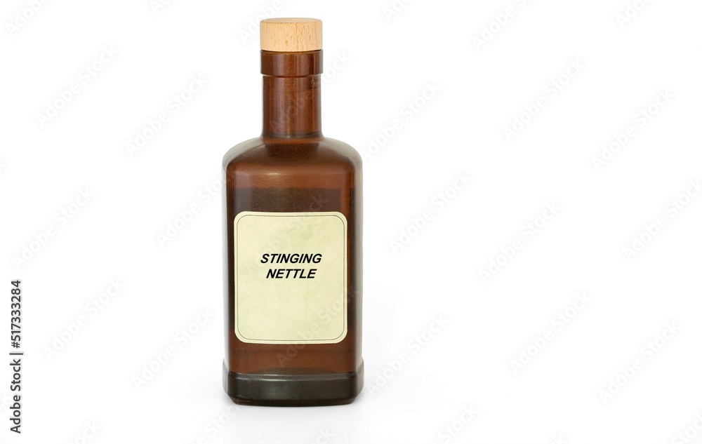 Herbal tincture in a antique retro bottle. Herbs medical solution of Stinging Nettle Herbal tincture in a antique retro bottle. Herbs medical solution of Stinging Nettle