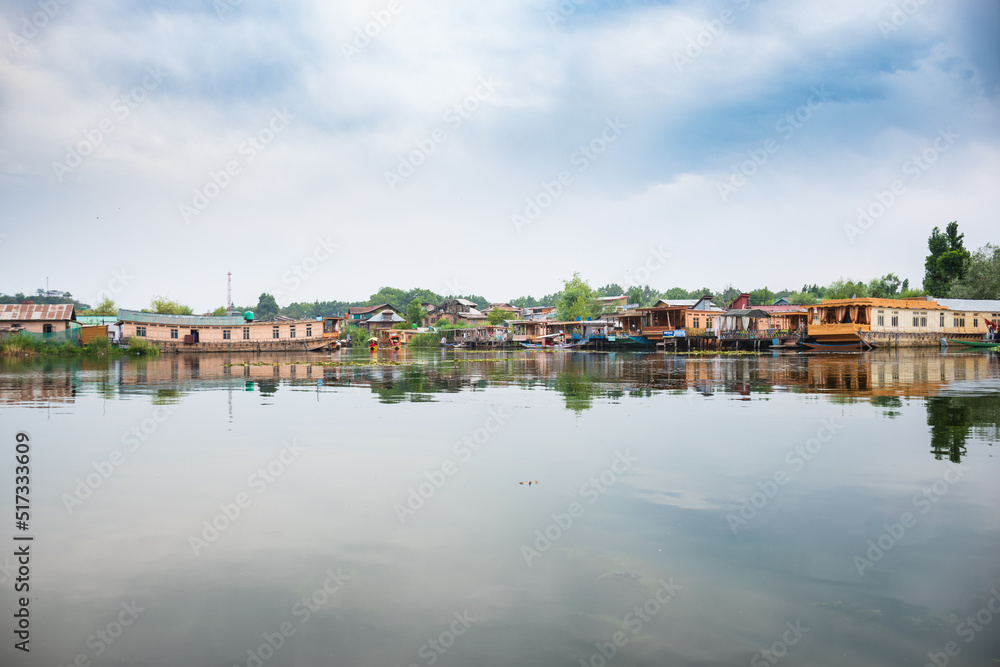 Lifestyle in Dal lake, local people use 'Shikara', a small boat for transportation in the lake in Srinagar, Kashmir, India. Lifestyle in Dal lake, local people use 'Shikara', a small boat for transportation in the lake in Srinagar, Kashmir, India.