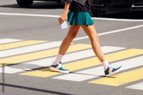 people crossing the road at a pedestrian crossing