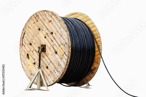 Large, wooden reel with electrical cable. Isolate on white background