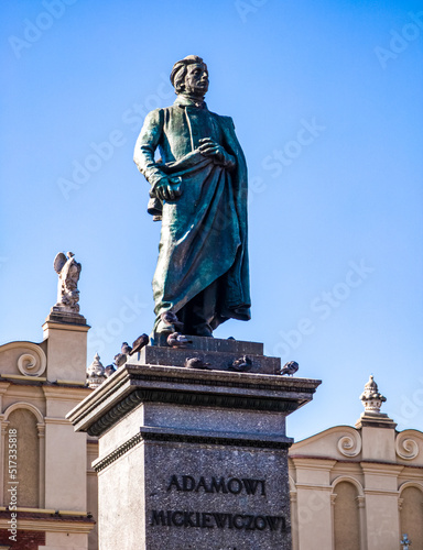 Adam Mickiewicz Monument in Krakow, Poland. Blue sky. photo