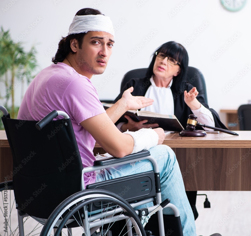 Disabled man consulting judge for damages litigation Disabled man consulting judge for damages litigation