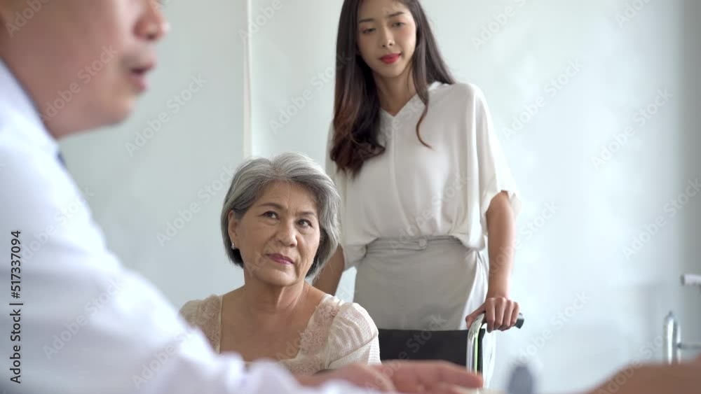 Asian young woman and her mother taking to doctor. Asian young woman and her mother taking to doctor.