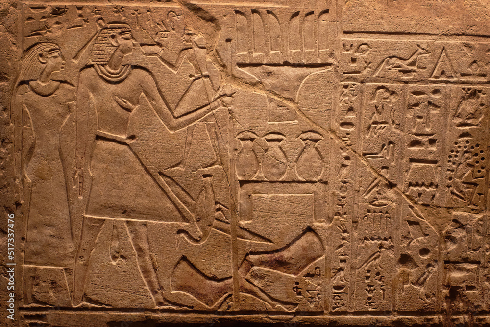 Hieroglyphic carving on an ancient Egyptian sargophagus in an ancient temple, selective focus Hieroglyphic carving on an ancient Egyptian sargophagus in an ancient temple, selective focus