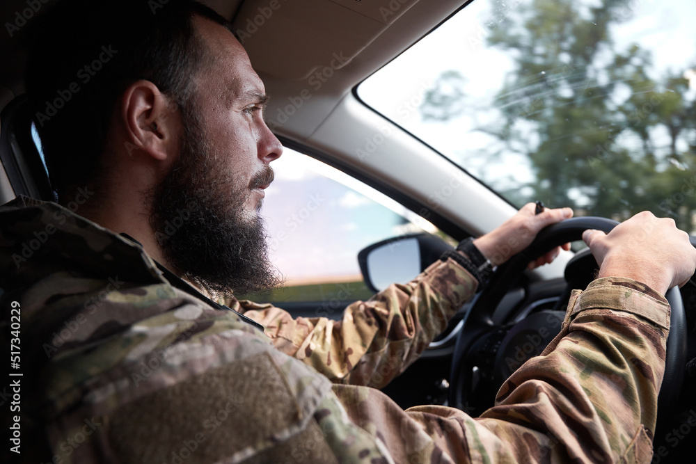 ukrainian soldier drive civilian car. Focused on road ukrainian soldier drive civilian car. Focused on road