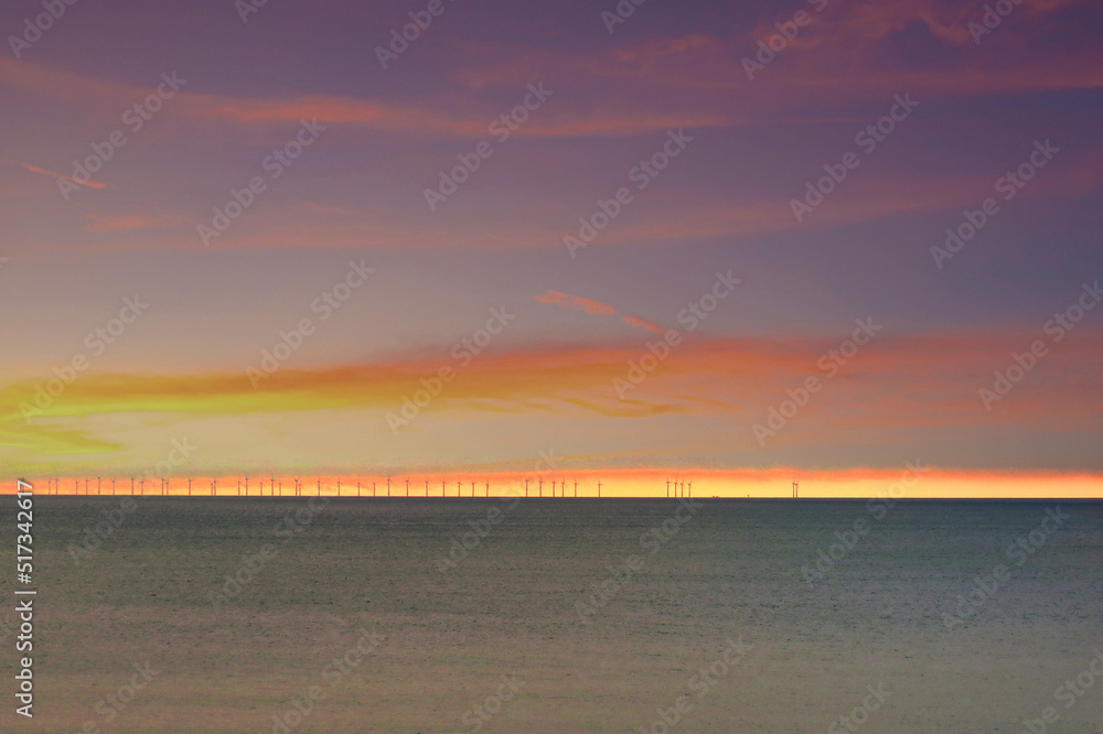 wind turbines Brighton at sunset