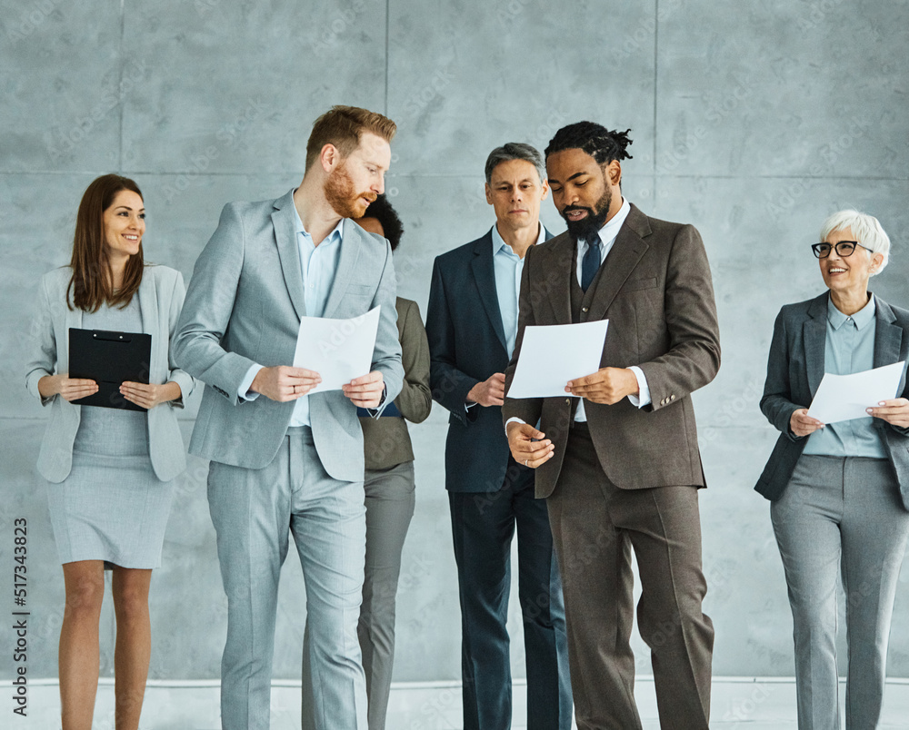 Fototapeta premium young business people meeting office teamwork group success corporate senior mature colleague together partner lobby