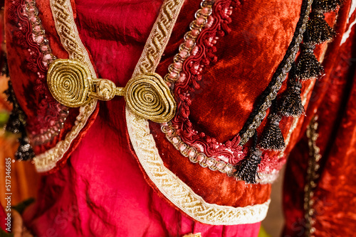 Details and textures of the fabric of a traditional Greek dress.
