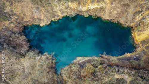 aerial view of blue lake in the forest © kadarj1980