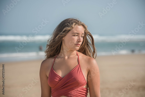 Beautiful young woman walking alone on the beautiful beaches of southwestern France