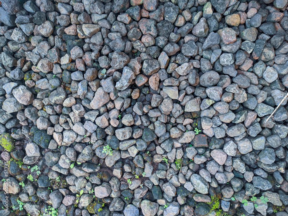 Top view gravel texture. Small road stone background. Dark gravel pebbles stone texture seamless texture. Top view gravel texture. Small road stone background. Dark gravel pebbles stone texture seamless texture.