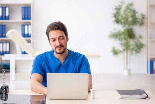 Young male doctor in telemedicine concept