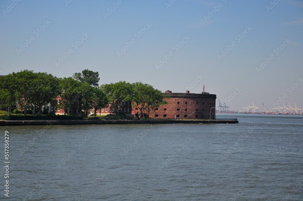 Castle Williams on Governors Island national park in Manhattan in New York City, New york on a sunny summer day on the hudson river.