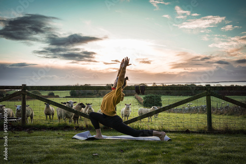 Yoga in front of Sheep in Ireland photo