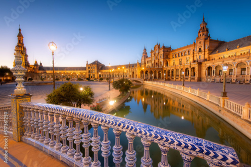 Plaza de Espana in Sevilla at dusk, Spain. panoramic. Built in 1928 for the Ibero-American Exposition of 1929.