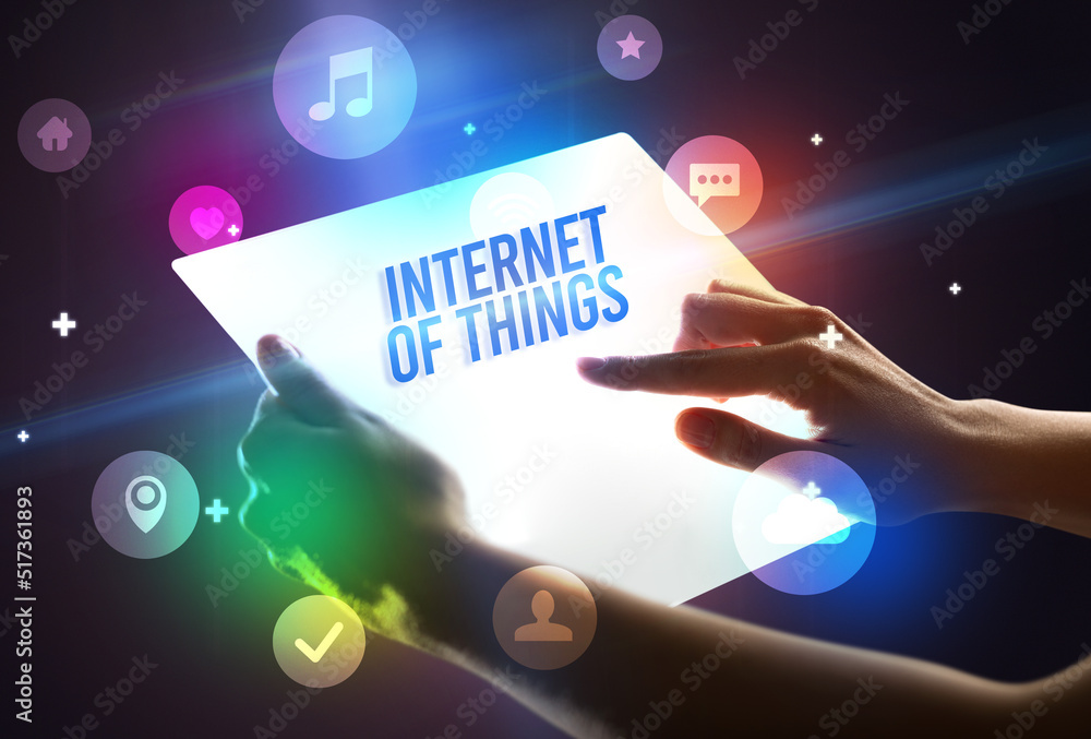 Holding futuristic tablet, new media concept Holding futuristic tablet, new media concept