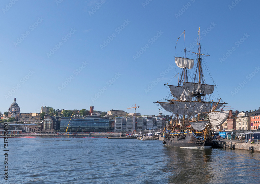 The old Indian Man Götheborg, at the pier Skeppsbron in the old town Gamla Stan, before leaving for the East India voyage arriving to Shanghai 2023, a sunny summer day in Stockholm The old Indian Man Götheborg, at the pier Skeppsbron in the old town Gamla Stan, before leaving for the East India voyage arriving to Shanghai 2023, a sunny summer day in Stockholm