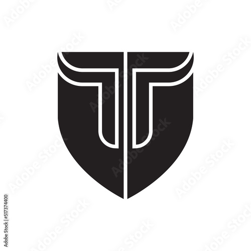 Shield with T letter logo design vector