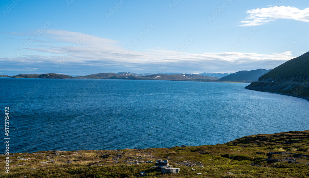 Sea coast and snowy hills in the background