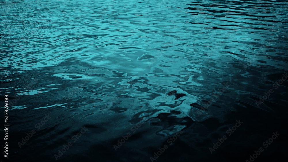 Blue green water. Ripples. Reflection of light. Little waves. Gradient. Dark teal color sea surface. Background with space for design.