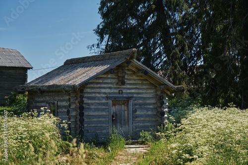 One of the most beautiful villages of Karelia Kinerma in summer. The old wooden house has been well preserved to our time. A small barn or storage. The concept of travel in Russia.